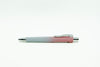 Gradient pen with white and pink design on a white background