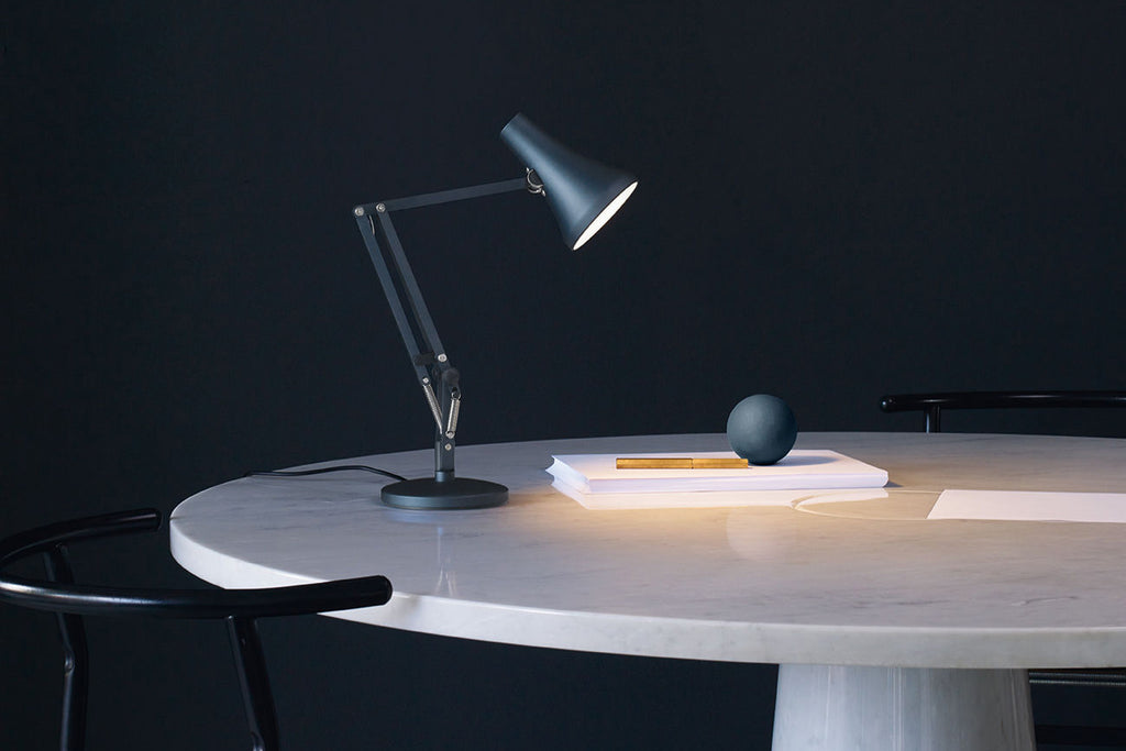 Table lit using an Anglepoise 90 Mini Mini Desk Lamp in Steel Blue